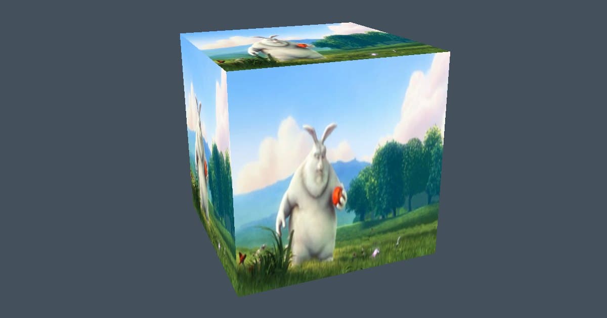 A cube rendered with wgpu, with Big Buck Bunny playing on its faces: the bunny stands in a meadow under a blue sky on the front face, and the same frame shows on the top and left faces.